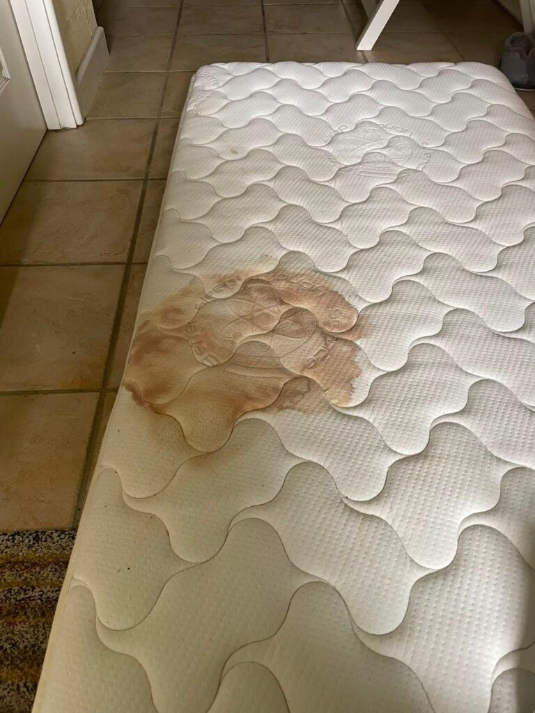 Stained mattress before cleaning by Merlin's Carpet Cleaning
